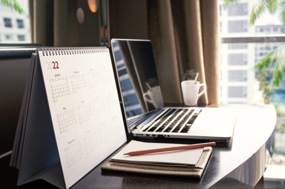 New,Normal,Concept:,Close,Up,Desktop,Calendar,2022,On,Wooden