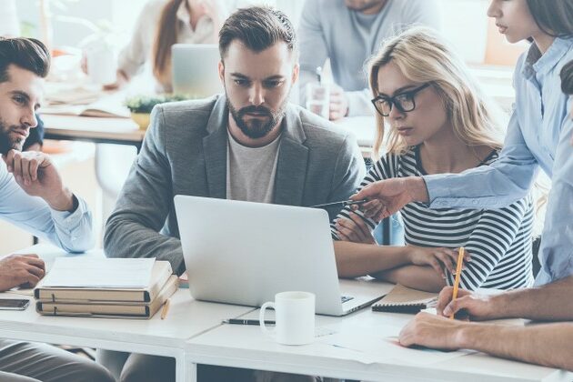Full,Concentration,At,Work.,Group,Of,Young,Business,People,Working
