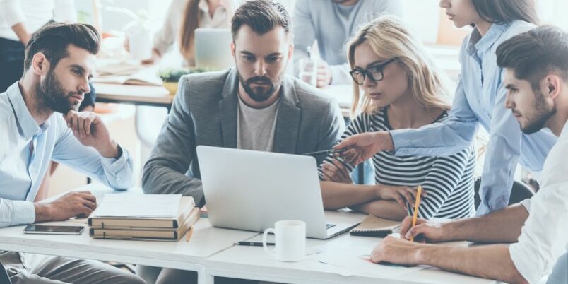 Full,Concentration,At,Work.,Group,Of,Young,Business,People,Working