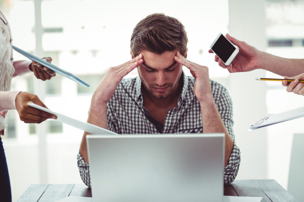 Businessman,Stressed,Out,At,Work,In,Casual,Office