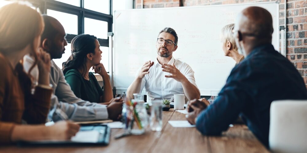Man,,Manager,And,Meeting,Or,Presentation,In,Boardroom,With,Coworkers
