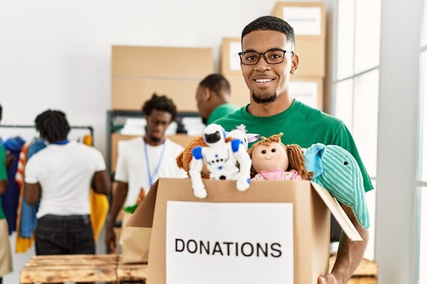 Group,Of,Young,African,American,Volunteers,Working,At,Charity,Center.