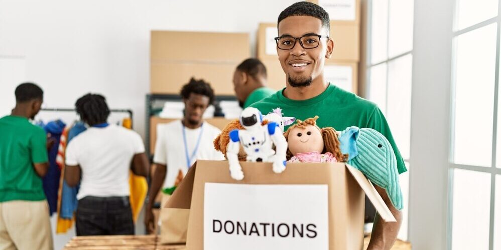 Group,Of,Young,African,American,Volunteers,Working,At,Charity,Center.